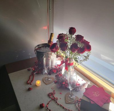 A vase of flowers on the table by a window