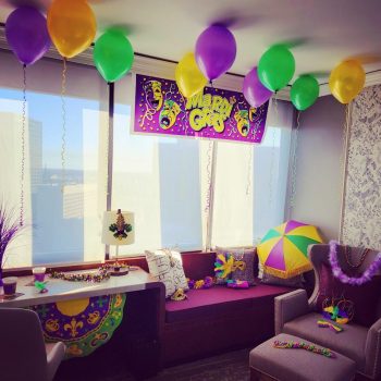 A room with balloons and decorations in it